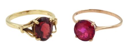 Gold single stone garnet ring and a rose gold red topaz ring