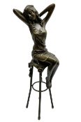 Art Deco style bronze modelled as a female figure seated upon a chair