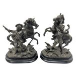 Pair of spelter figural statues of man in period dress