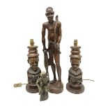 Pair of 20th century carved wood table lamp with African busts and figures