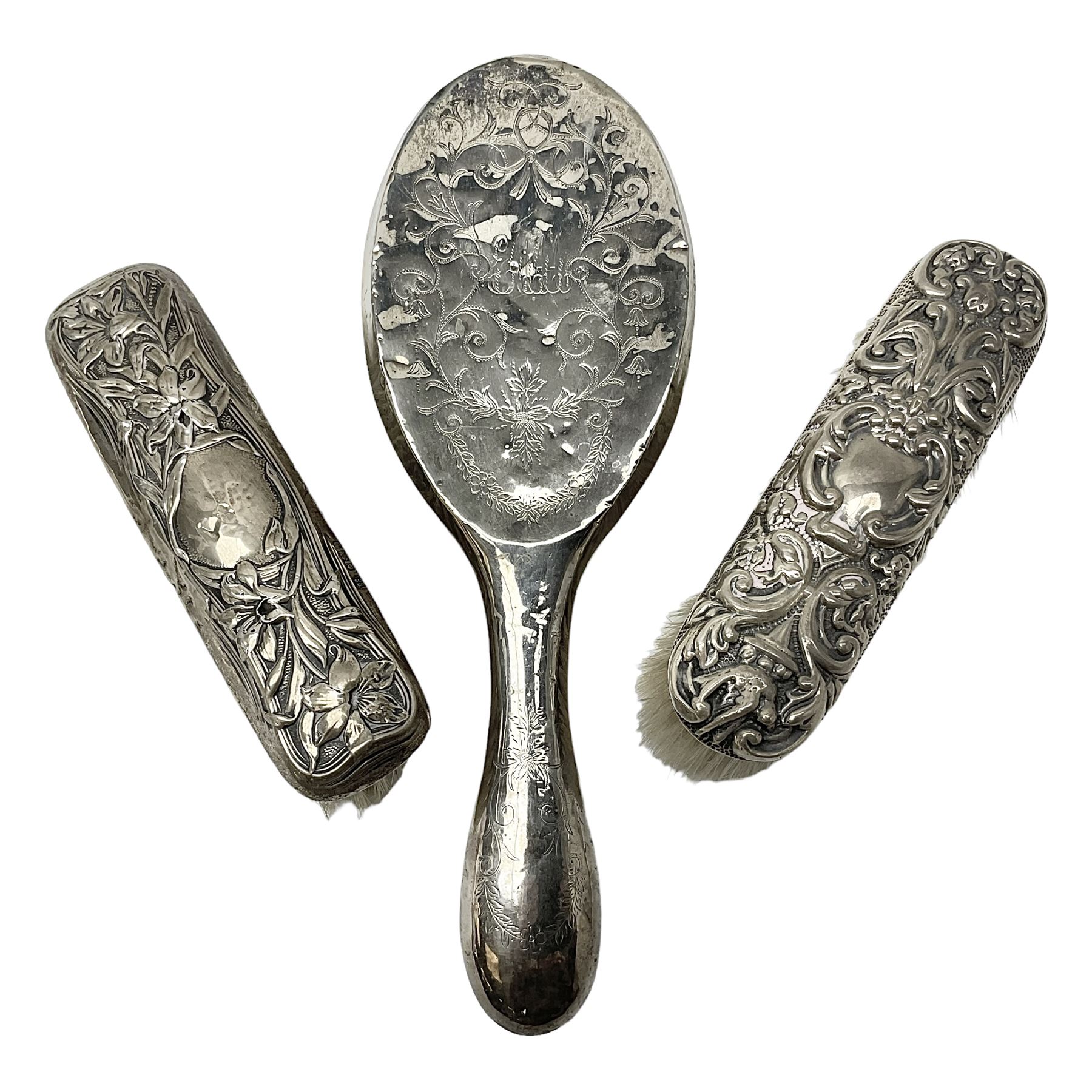 Three silver mounted dressing table brushes