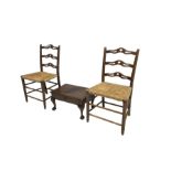 Pair 19th century waived and pierced ladder back kitchen chairs with rush seats