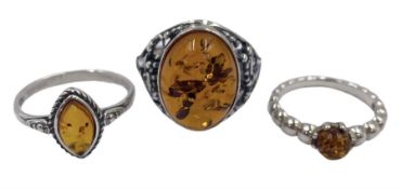 Three silver Baltic amber rings