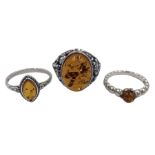 Three silver Baltic amber rings