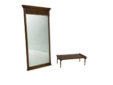 Oak framed mirror with floral carved lower frieze (130cm x 57cm); and a small oak breakfast in bed t