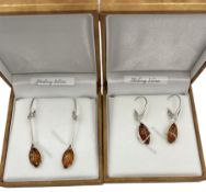 Two pairs of silver Baltic amber pendant earrings