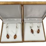 Two pairs of silver Baltic amber pendant earrings