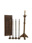 Ecclesiastical oak torchere candle stand; Small panelled oak door with foliate arch applied moulding