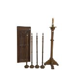 Ecclesiastical oak torchere candle stand; Small panelled oak door with foliate arch applied moulding