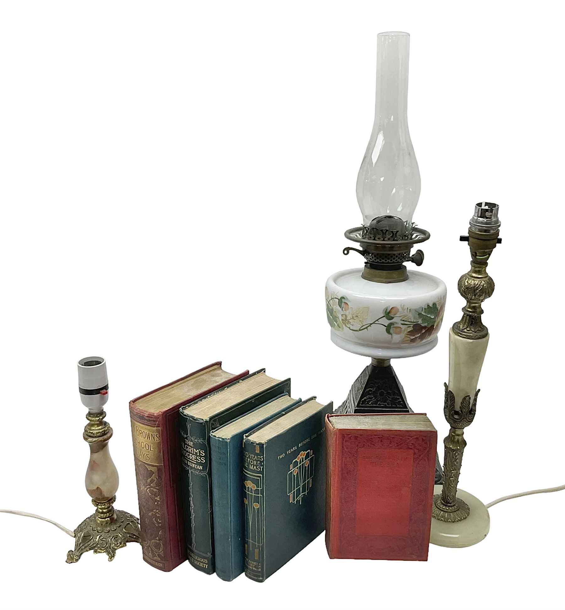 Oil lamp with ornate metal base and painted glass reservoir