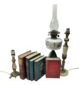 Oil lamp with ornate metal base and painted glass reservoir