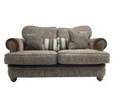 'Canterbury' two seat sofa upholstered in brown fabric with contrasting textures