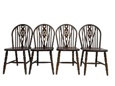 Set four mahogany wheel back dining chairs