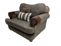 'Canterbury' snuggler sofa upholstered in brown fabric with contrasting textures