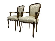 Pair Louis XVI design walnut framed salon armchairs