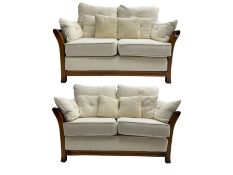 Pair mid-to late 20th century stained beech two seat sofas