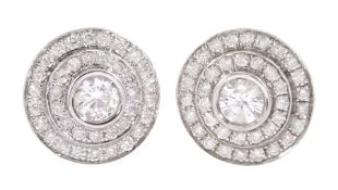 Pair of 18ct white gold round brilliant cut diamond halo stud earrings