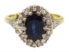 18ct gold oval cut sapphire and round brilliant cut diamond cluster ring