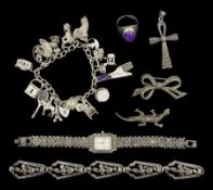 Collection of silver jewellery including charm bracelet
