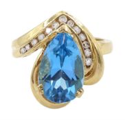 14ct gold pear cut blue topaz and round brilliant cut diamond ring