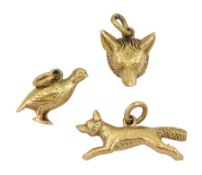 Three 9ct gold charms including foxes head