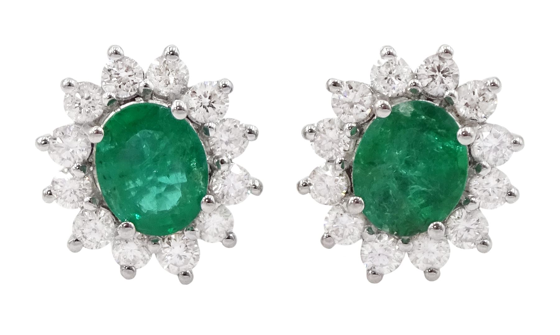 Pair of 18ct white gold emerald and diamond cluster stud earrings