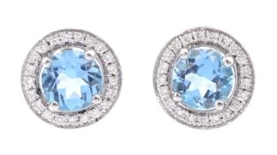 Pair of 18ct white gold blue topaz and round brilliant cut diamond circular stud earrings