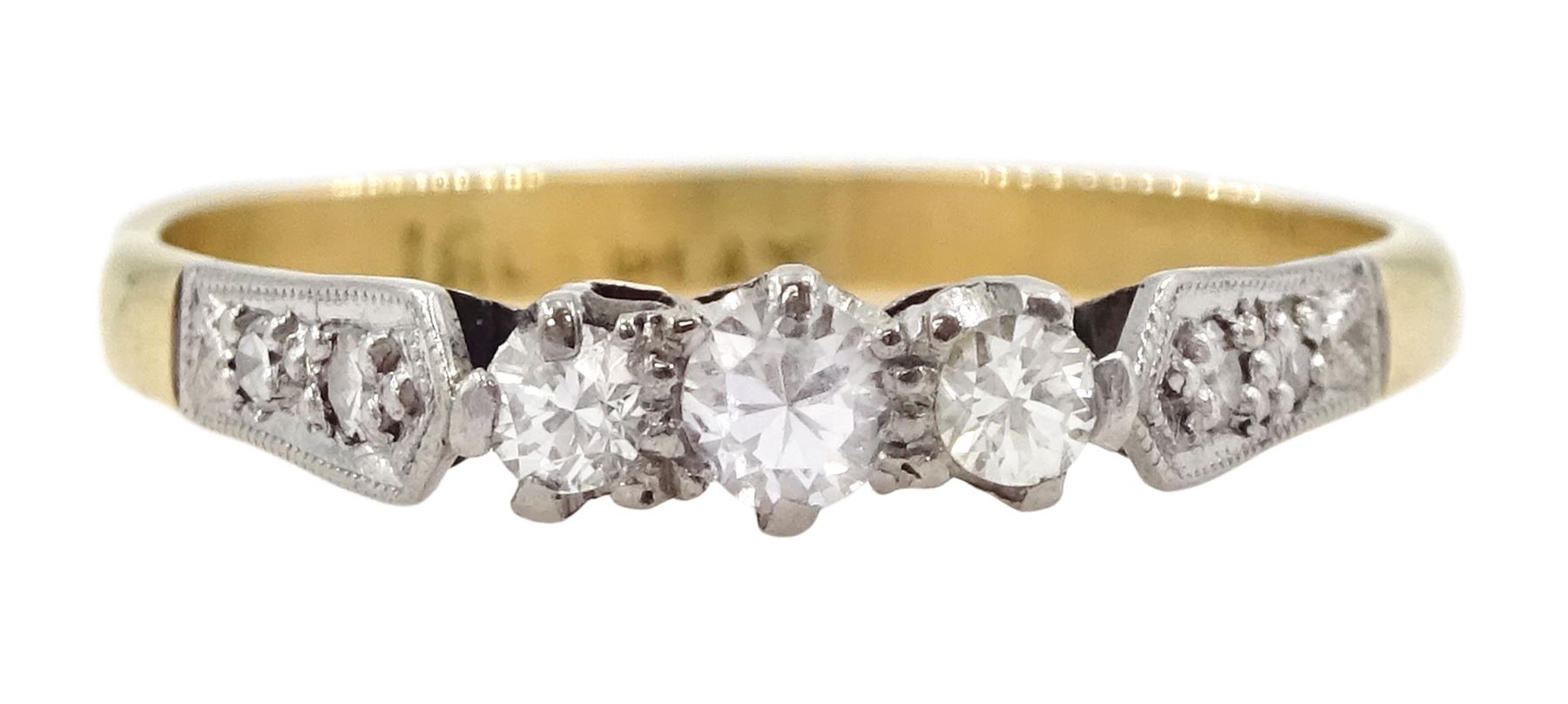 Gold three stone diamond ring