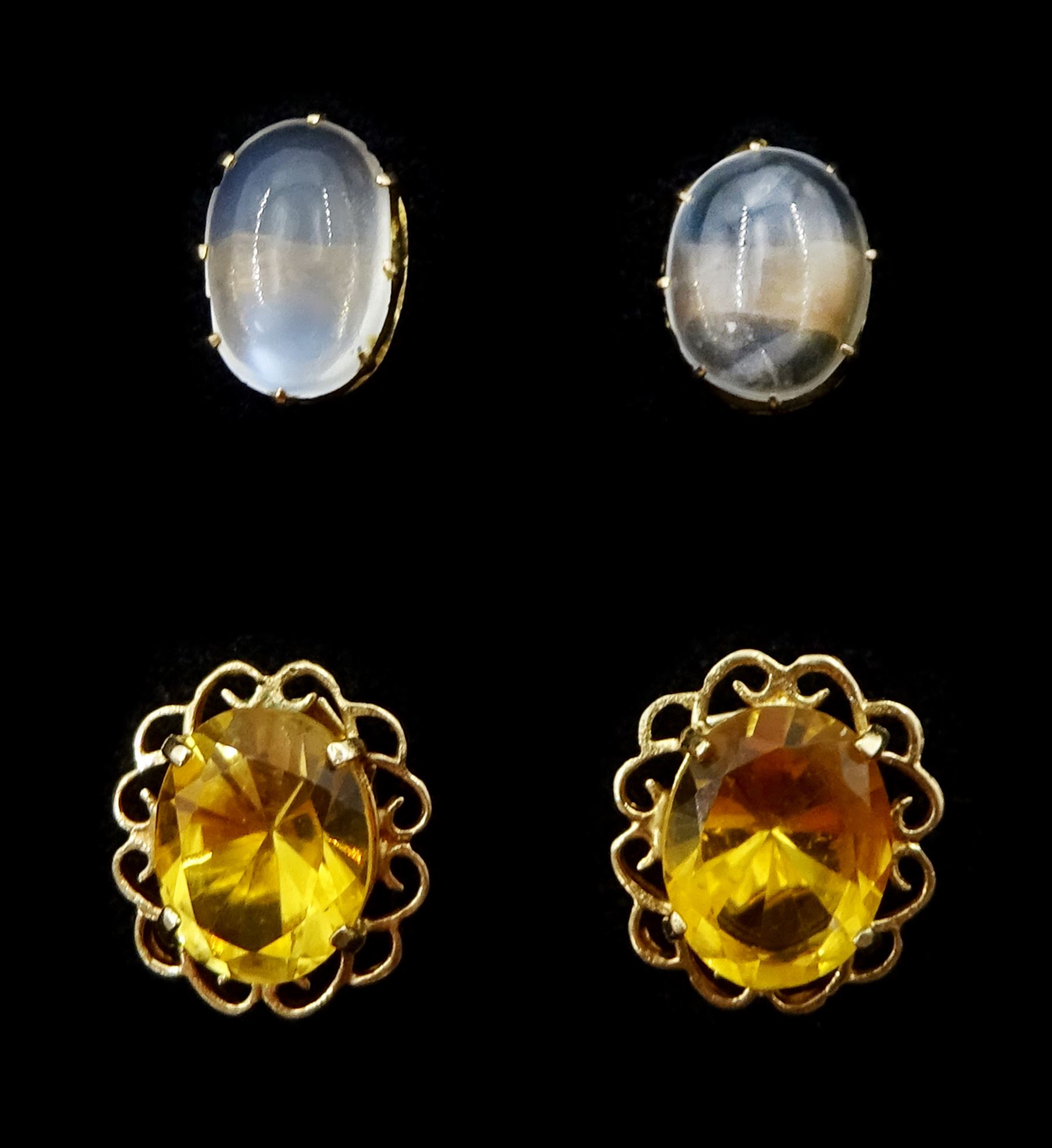 Pair of gold cabochon moonstone stud earrings and a pair of gold citrine stud earrings