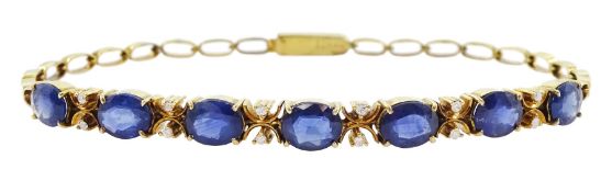 14ct gold oval cut sapphire and round brilliant cut diamond bracelet