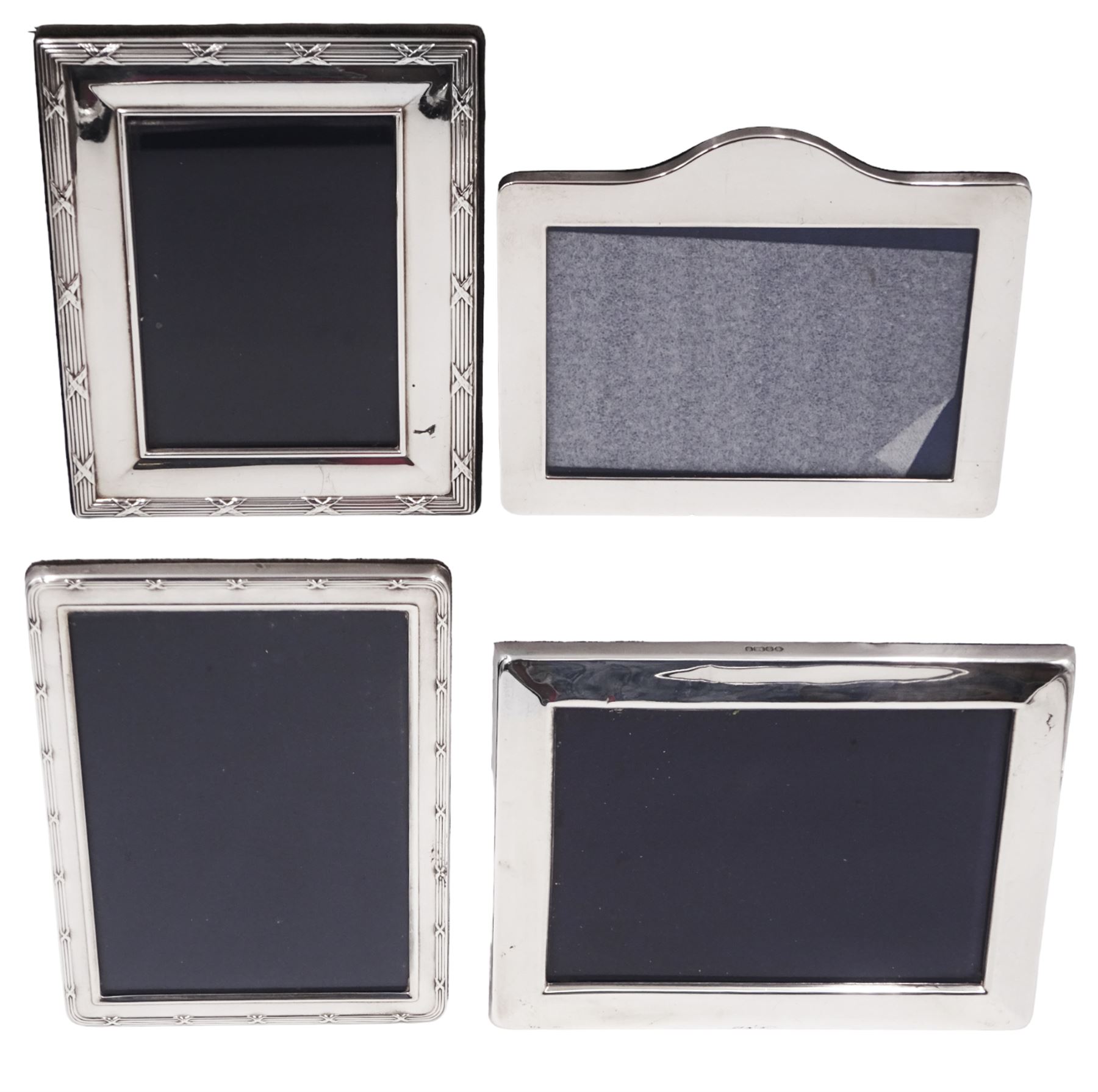 Four modern silver mounted photograph frames