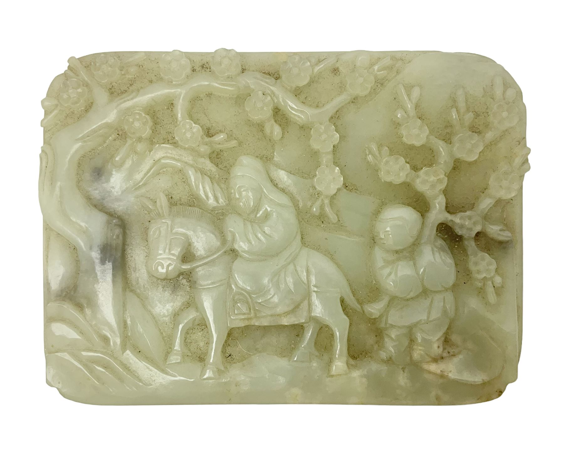 Pale celadon jade plaque carved in one side with a man riding his horse underneath flowering trees