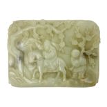 Pale celadon jade plaque carved in one side with a man riding his horse underneath flowering trees