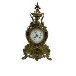 French - late 19th century 8-day gilt brass mantle clock surmounted by an urn