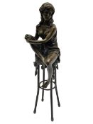 Art Deco style bronze modelled as a female figure seated upon a chair