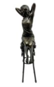 Art Deco style bronze modelled as a female figure seated upon a chair