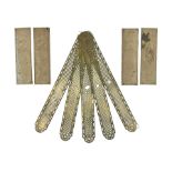 Set of five brass pierced door plates