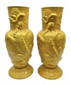 Pair of 20th century large floor standing vases with decorated in relief on yellow ground