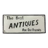 Cast iron sign 'The Best Antiques Are Old Friends'