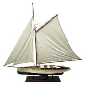 Wooden kit built model yacht with sails