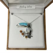 Silver Baltic amber and turquoise toucan pendant necklace