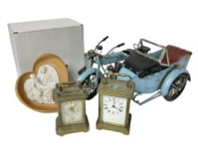 Two carriage clocks; boxed La Pieta figurine; and boxed metal model of a combination motorcycle (4)