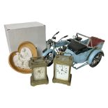 Two carriage clocks; boxed La Pieta figurine; and boxed metal model of a combination motorcycle (4)