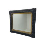 Small black painted and gilt wall mirror