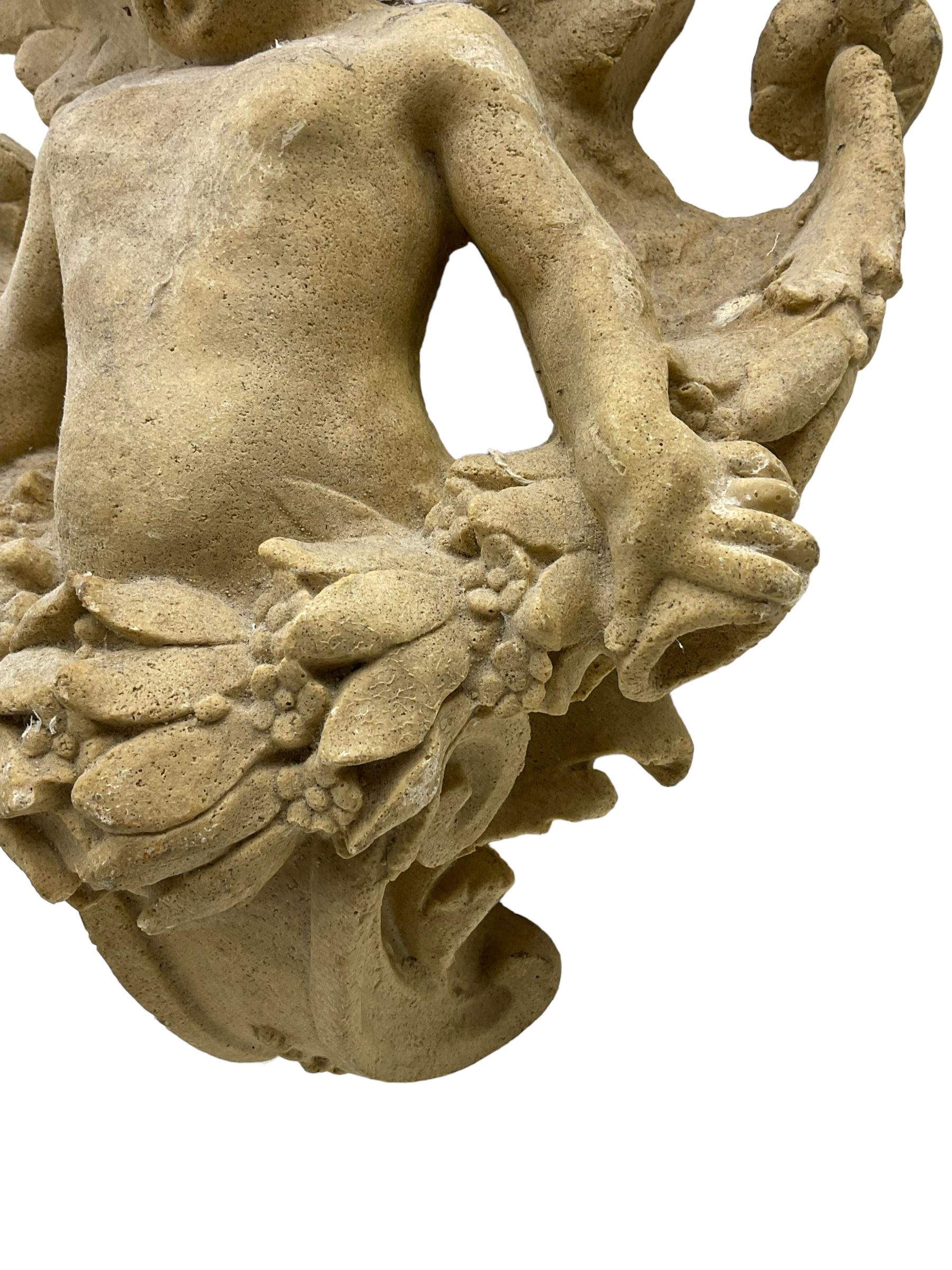 Sandstone finish moulded fibre-glass wall mounting figure of a winged cherub - Image 3 of 5