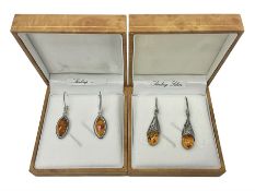 Two pairs of silver Baltic amber pendant earrings