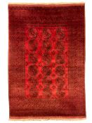 Persian Bokhara crimson ground carpet