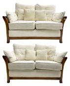 Pair mid-to late 20th century stained beech two seat sofas