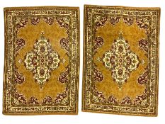 Pair Persian design amber ground rugs