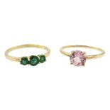 Gold three stone emerald ring and a gold single stone pink danburite ring